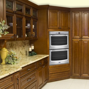 dark wooden colored cabinets with silver oven