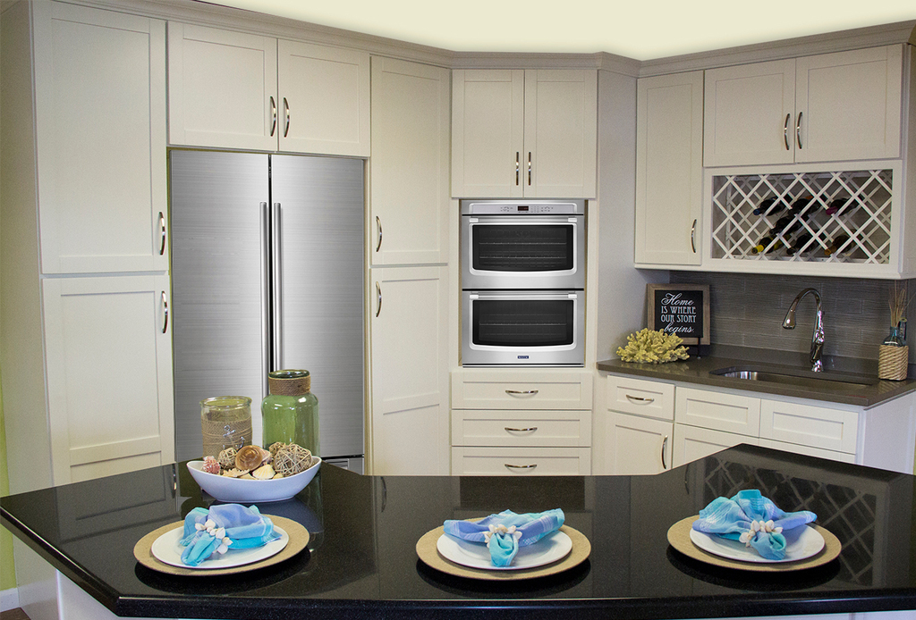 cleaned up kitchen with silver appliances and white cabinets